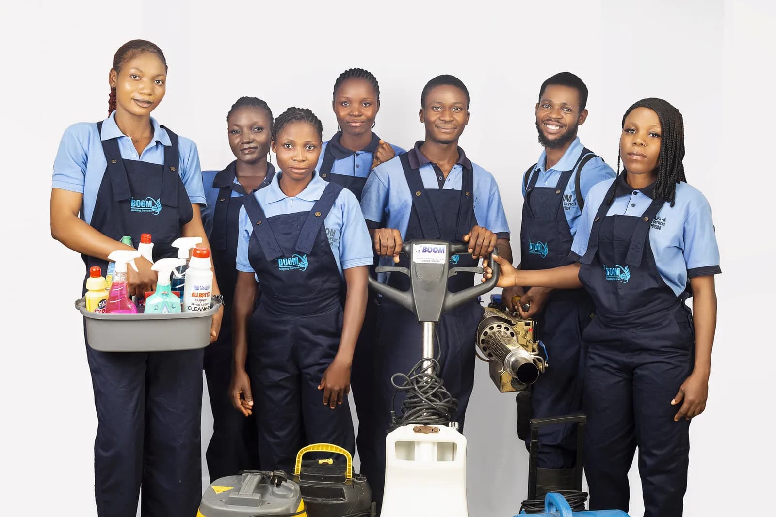 The full BOOM Cleaning team standing in uniform with professional equipment